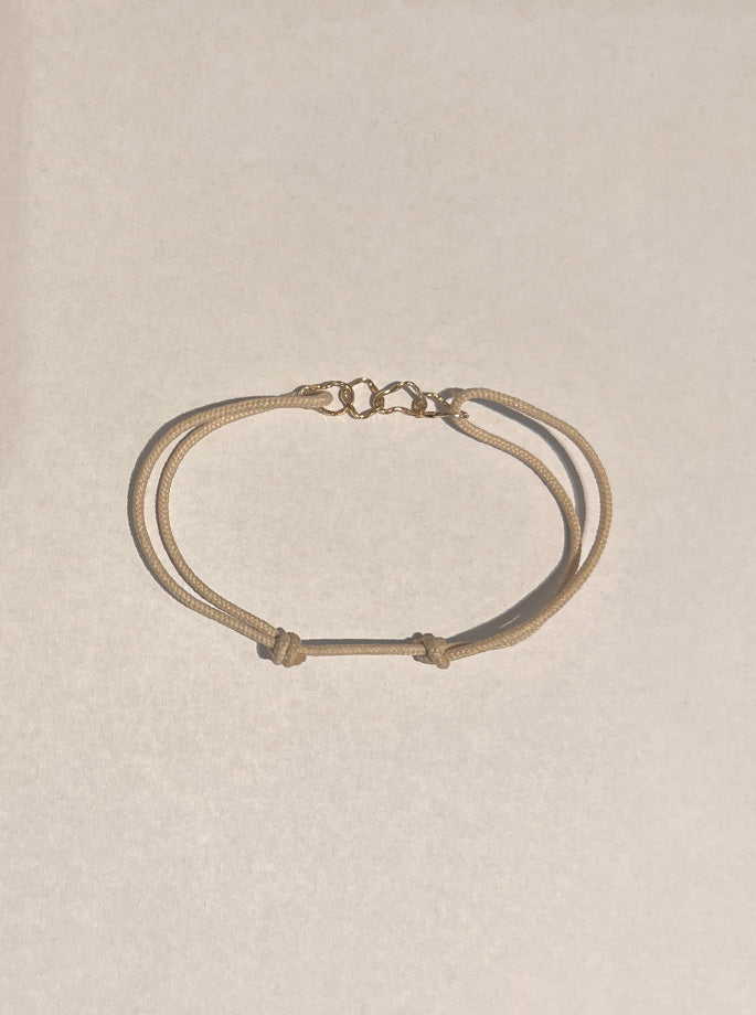 Nordenstam - Armbånd med 4 Guld Ringe Råhvid